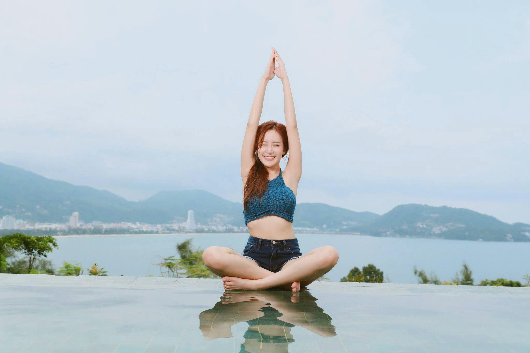 pexels-photo-460307-460307 Young woman doing yoga by a scenic waterfront, enjoying a serene landscape.